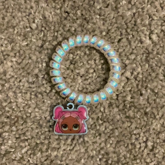 This is an lol doll bracket/hair-tie - Picture 1 of 1